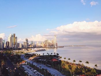 High angle view of street by sea against sky