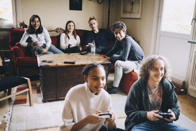 Friends sitting on mobile phone