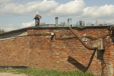 Closed gate against sky