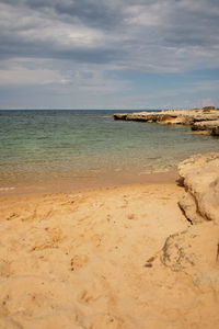 Scenic view of beach against sky