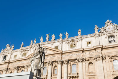 Low angle view of historic building against clear blue sky