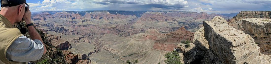 Panoramic view of landscape against cloudy sky