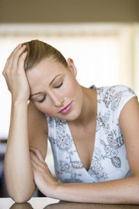 Young woman suffering from headache