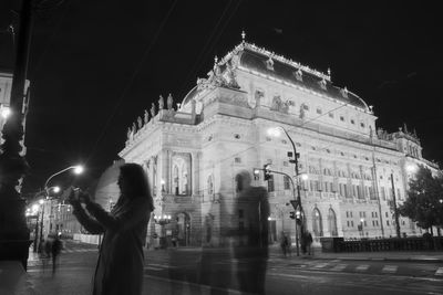 Low angle view of people in city