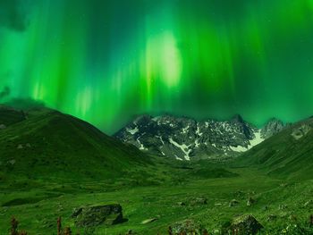 Scenic view of landscape against sky at night