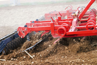 High angle view of red machinery on field