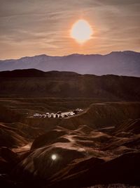 Scenic view of landscape against sky during sunset