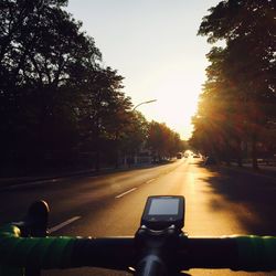 Car on road at sunset