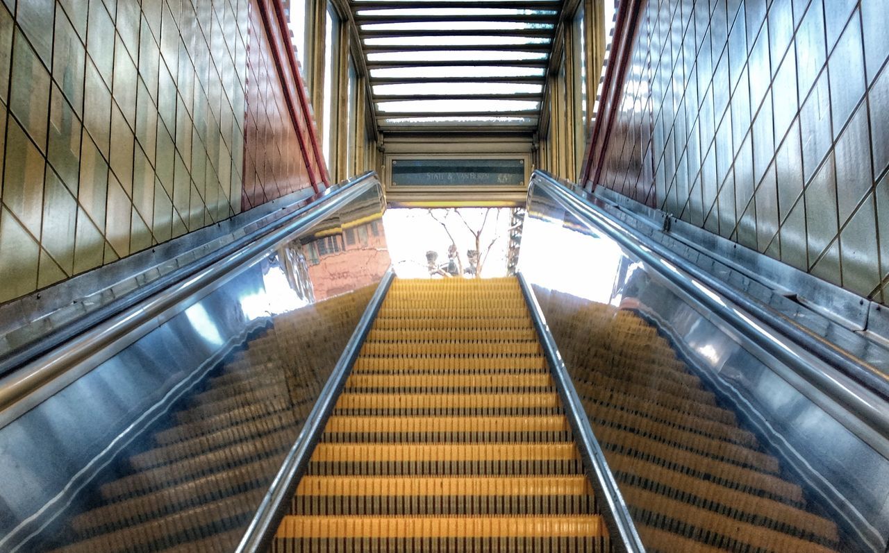 indoors, steps and staircases, steps, staircase, escalator, architecture, built structure, railing, modern, the way forward, low angle view, diminishing perspective, building, high angle view, building exterior, metal, vanishing point, convenience, stairs, day