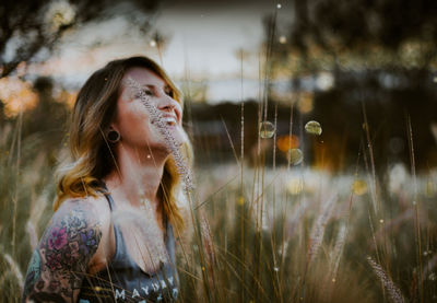 Close-up of young woman in grass
