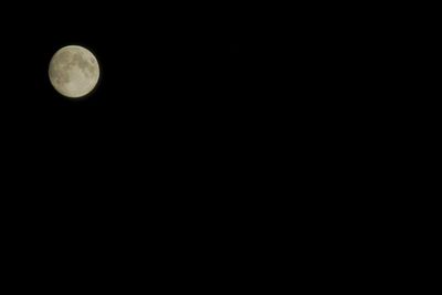 Low angle view of moon against sky at night