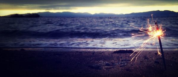 Scenic view of mountains against sky at sunset