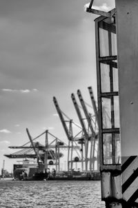 View of cranes against sky