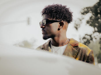 Low angle view of young man looking away