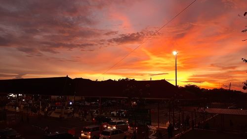 Silhouette buildings against sky during sunset