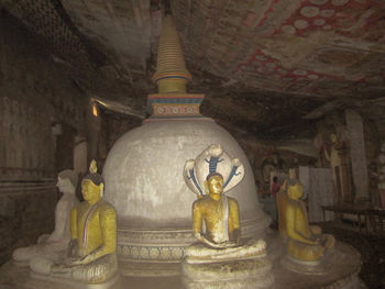 Buddha statue in temple outside building