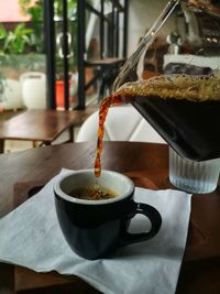 Close-up of coffee cup on table