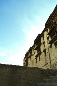 Low angle view of built structure against blue sky