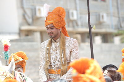 Groom sitting on horse during wedding