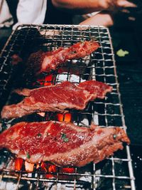 Close-up of meat on barbecue grill