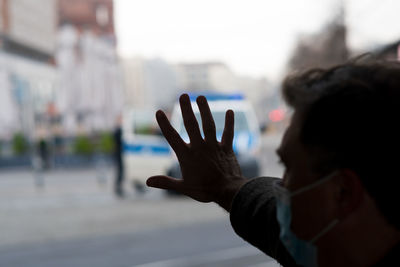Male hand asking for help from the police. selective focus on foreground