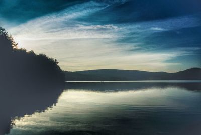 Reflection of clouds in calm lake