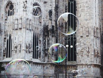 Close-up of bubbles against building