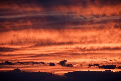 Scenic view of silhouette landscape against sky at sunset