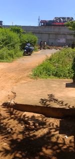 Road by building against sky