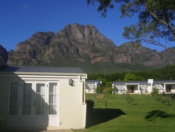 Building against mountain range and blue sky