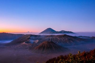 View of volcanic mountain against sky during sunset