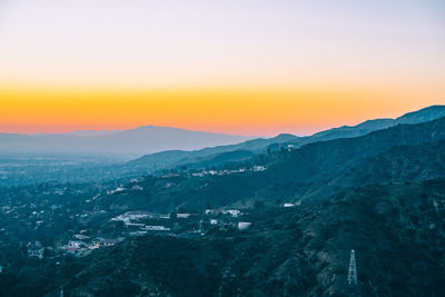 Scenic view of landscape against sky during sunset