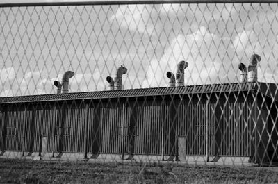 A view of a factory through a fence