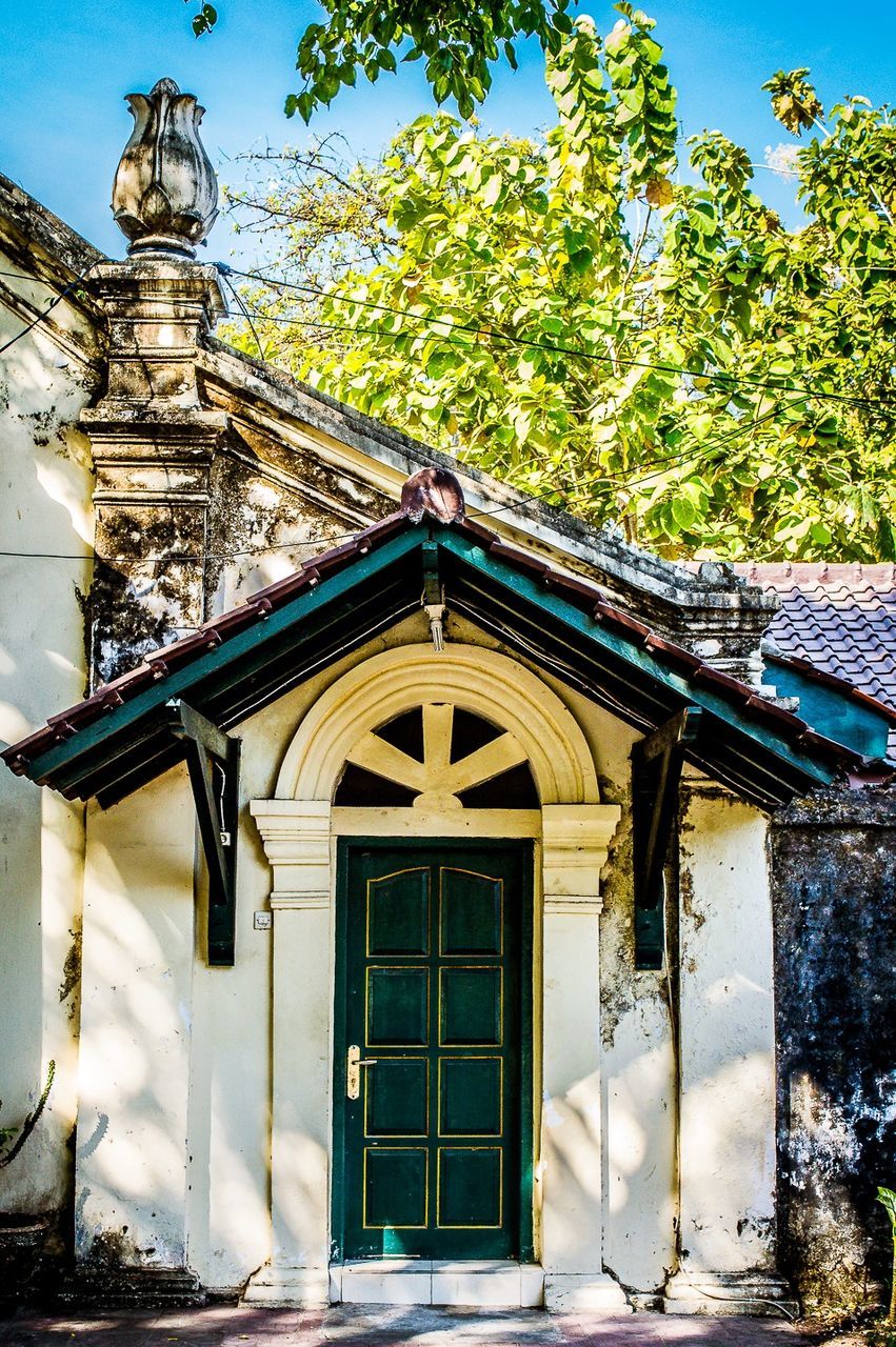 architecture, built structure, building exterior, entrance, outdoors, low angle view, day, no people, door, tree, facade, place of worship, sky