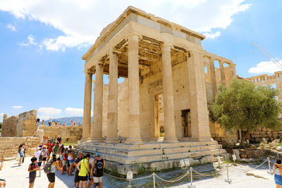 Group of people in front of historical building