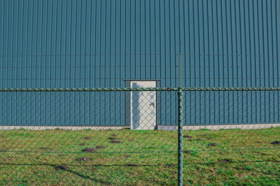 Fence against corrugated iron