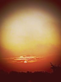 Scenic view of silhouette trees against romantic sky at sunset