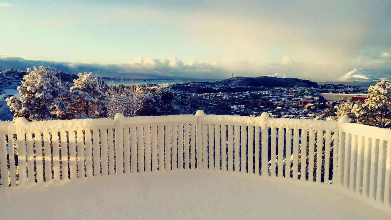 built structure, sky, architecture, building exterior, railing, mountain, cloud - sky, tree, snow, cloud, city, nature, winter, tranquil scene, high angle view, scenics, mountain range, cold temperature, river, water