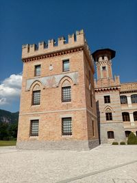 Low angle view of building against blue sky