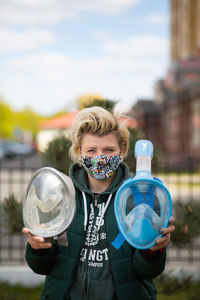 Portrait of boy holding bubbles