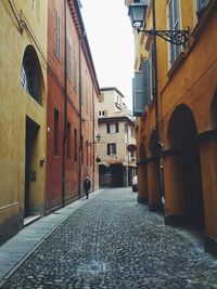 Alley amidst buildings in city