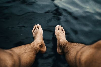 Low section of man by lake