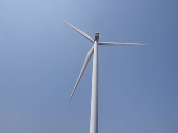 Low angle view of wind turbine against sky