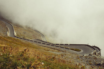 Road by land against sky