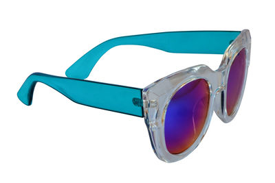 Close-up of sunglasses over white background