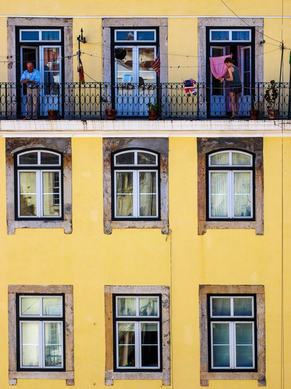 YELLOW BUILDING WITH WINDOWS