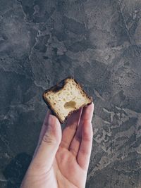 Close-up of hand holding ice cream cone