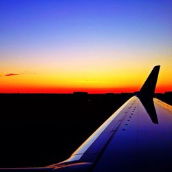 Cropped image of airplane flying in sky