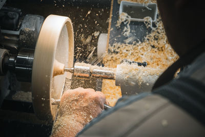 Close-up of worker working in factory