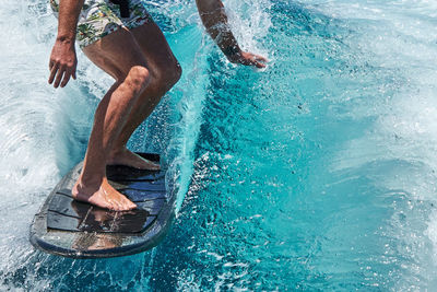 Low section of man in swimming pool